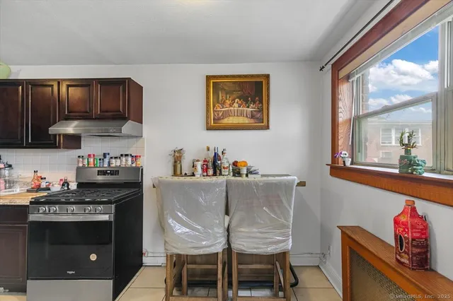 a kitchen with a stove and cabinets