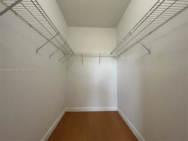 a view of a room with racks on the wall