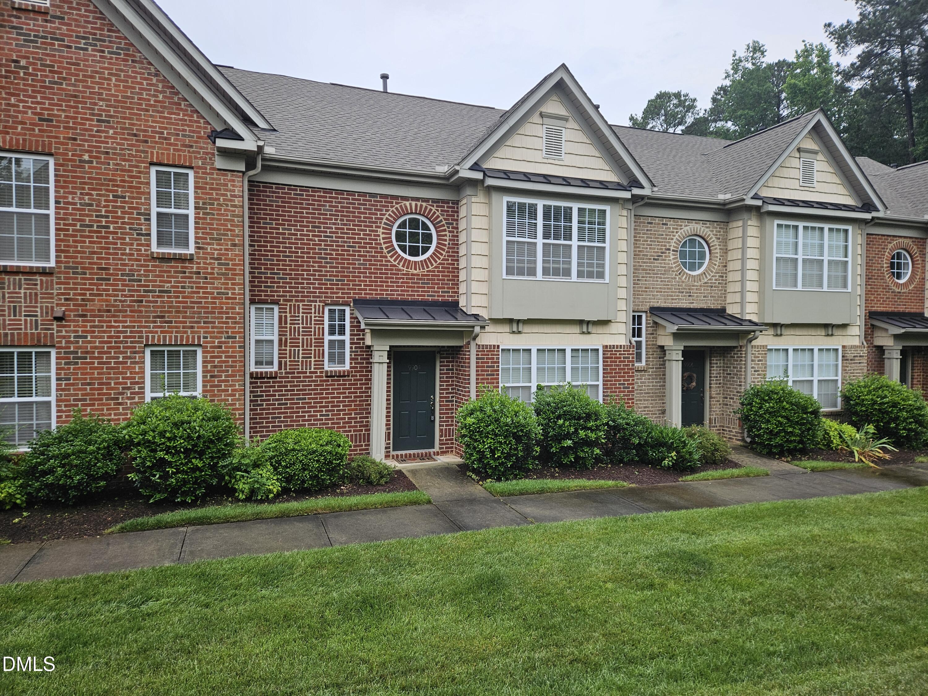 9904 Layla Avenue Raleigh, NC 27617 - Photo 1 of 19 a front view of a house with a yard and outdoor seating