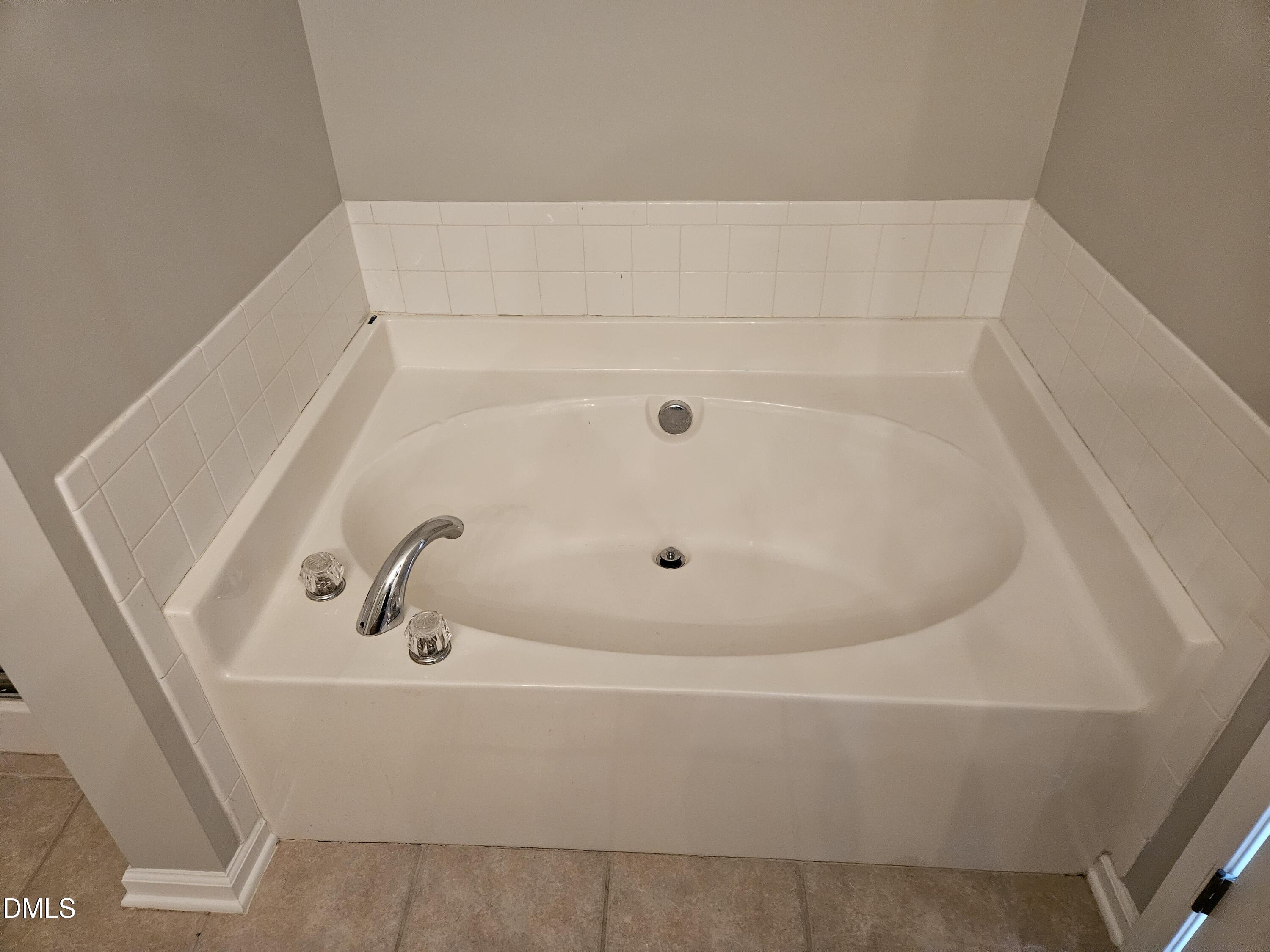 9904 Layla Avenue Raleigh, NC 27617 - Photo 15 of 19 a bathroom with a tub