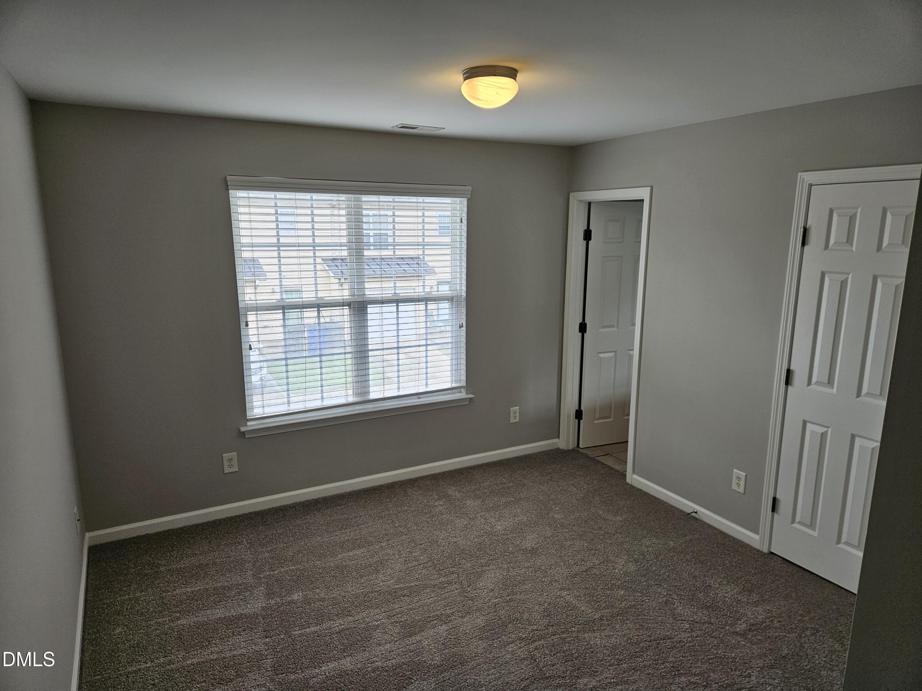 9904 Layla Avenue Raleigh, NC 27617 - Photo 16 of 19 an empty room with windows