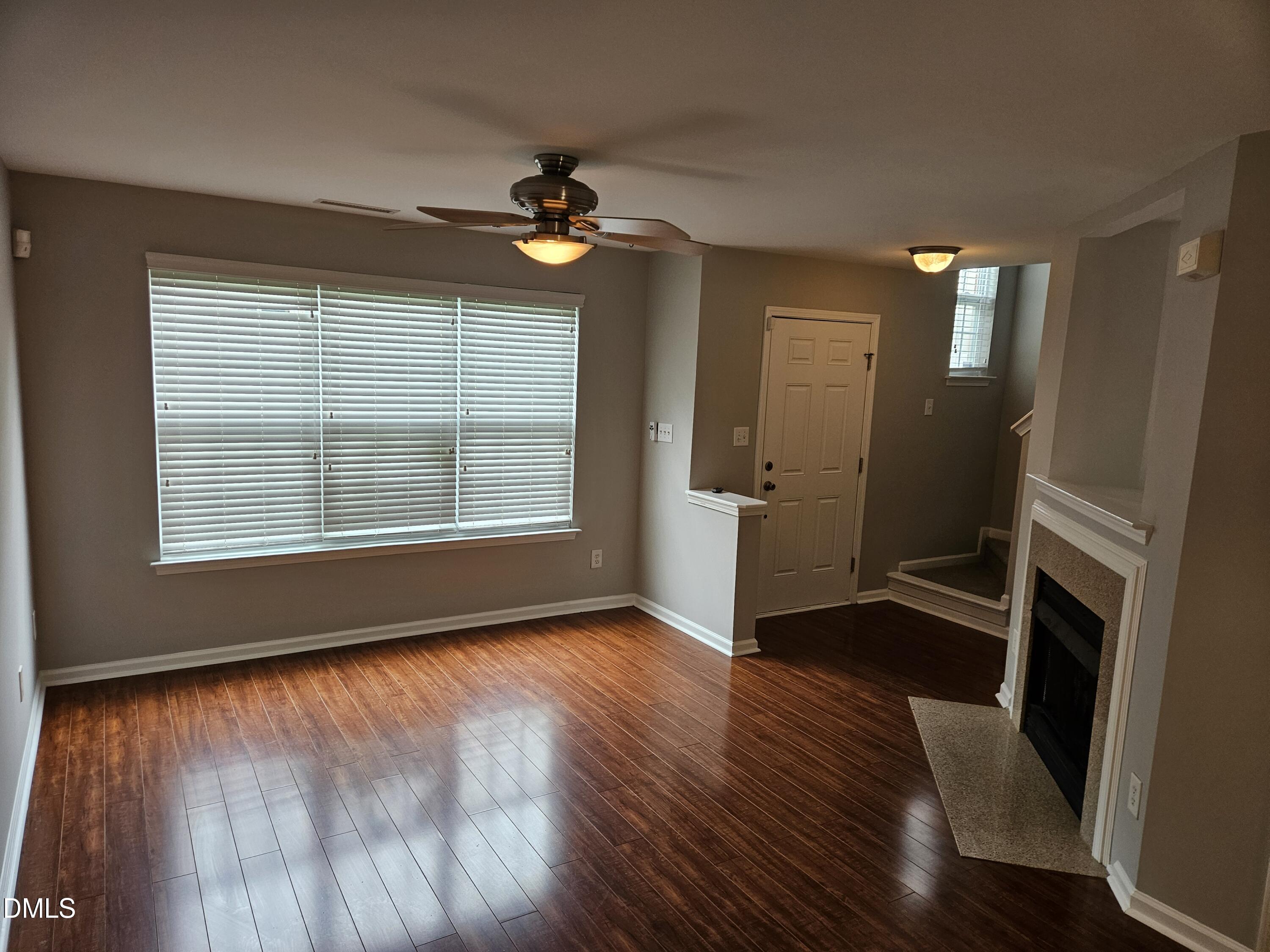 9904 Layla Avenue Raleigh, NC 27617 - Photo 6 of 19 wooden floor in an empty room with a window