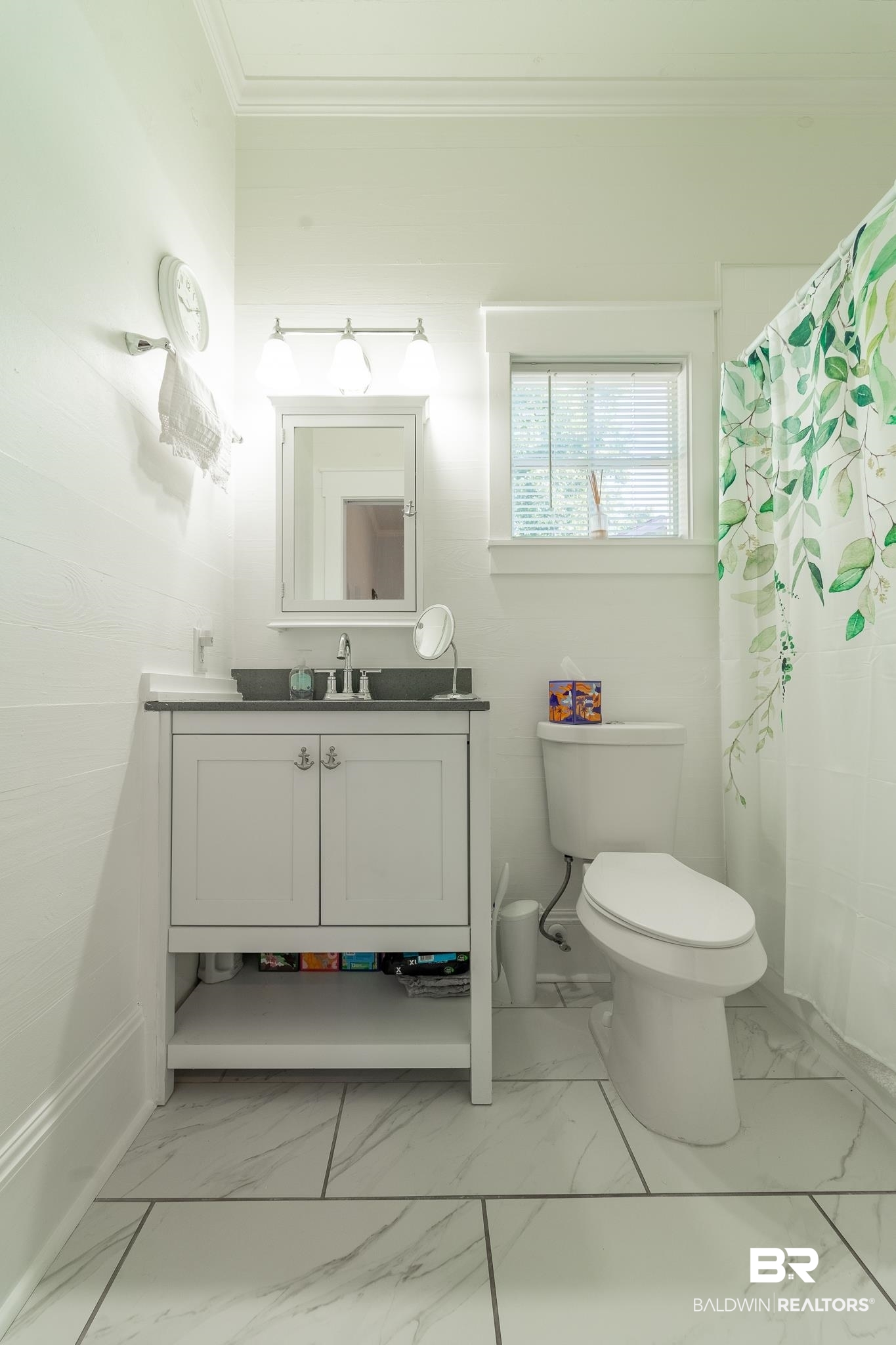 950 Texas Street Mobile, AL 36604 - Photo 11 of 17 Bathroom featuring a shower with curtain, toilet, tile patterned flooring, vanity, and ornamental molding