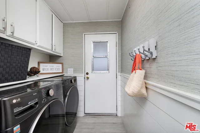 a view of walk in closet with clothes