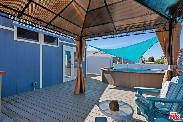 a view of deck with wooden floor and chair