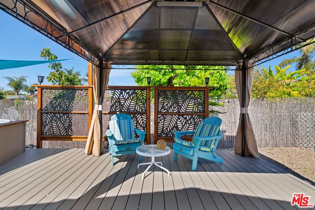 a view of a chairs on the roof deck