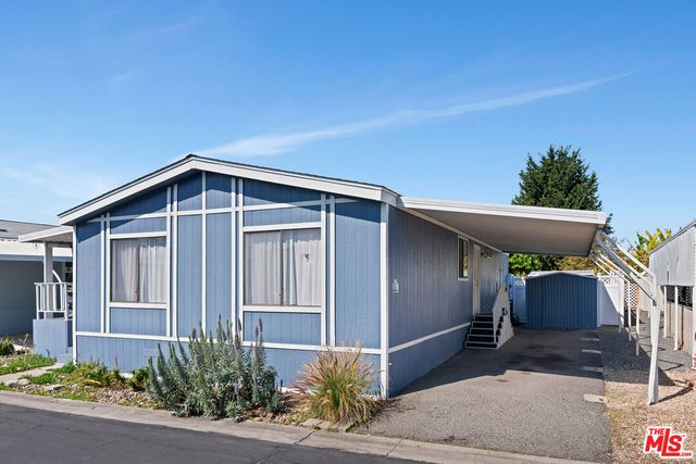 a front view of a house with garage