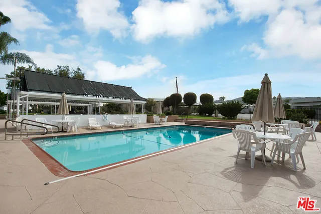 a view of swimming pool with a yard