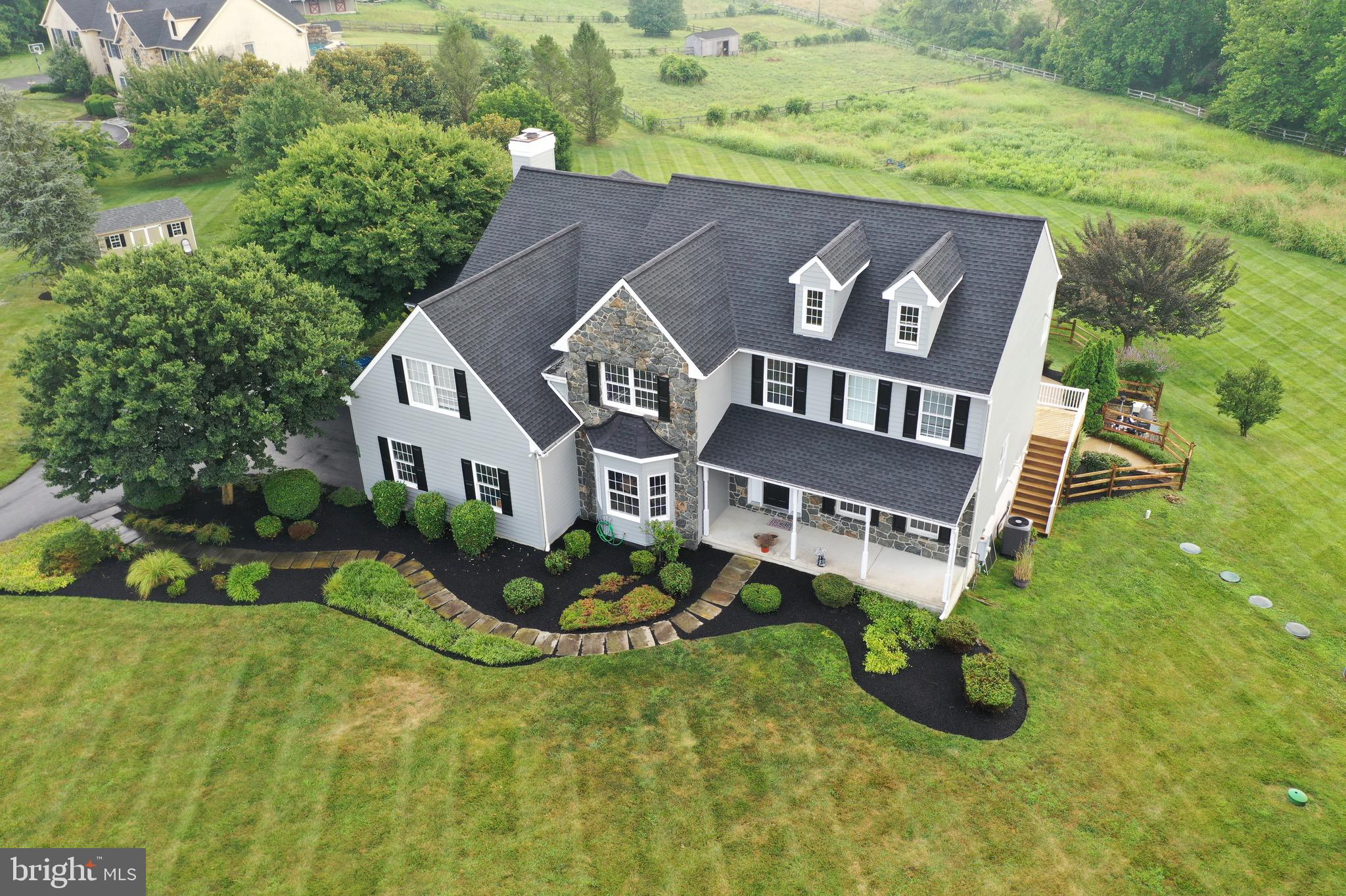 106 Sawmill Road Landenberg, PA 19350 - Photo 1 of 4 a front view of a house with garden