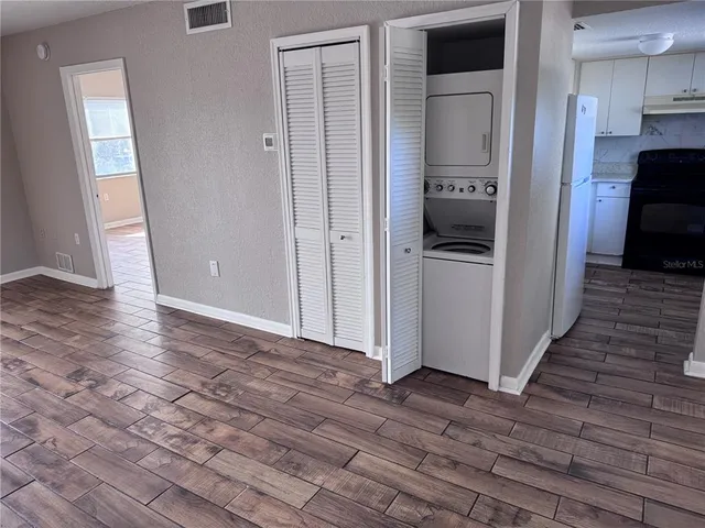 a view of a kitchen from the hallway