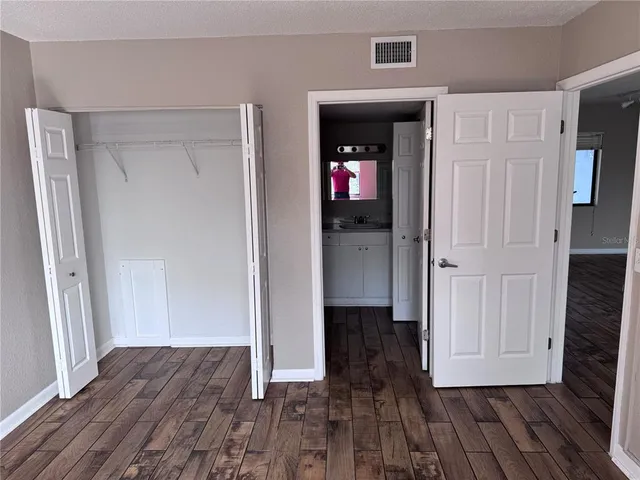 wooden floor with white walls