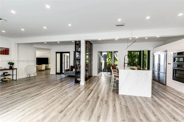 a view of a living room and entry way