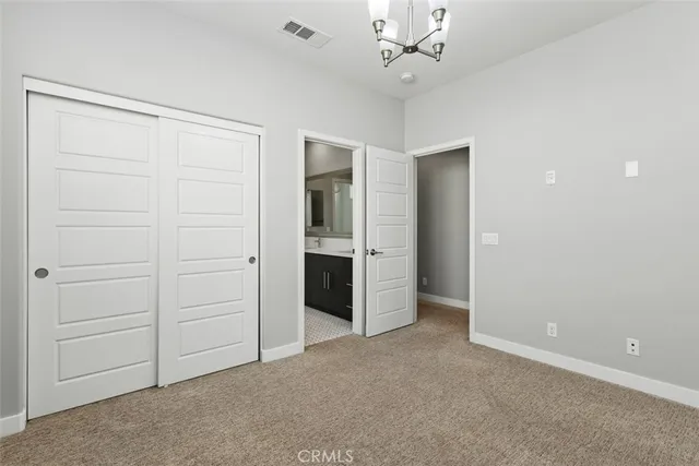 a outdoor space with lots of tables chairs and potted plants
