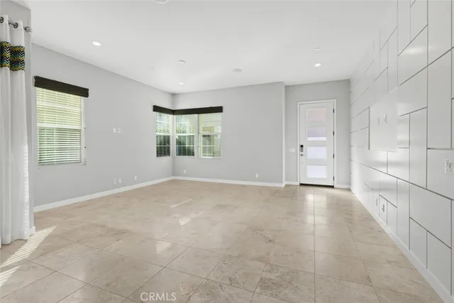 a kitchen with stainless steel appliances a sink a stove a refrigerator a sink and cabinets