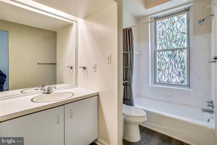 1900 3rd Street Northwest, Unit 2 Washington, DC 20001 - Photo 11 of 14 a bathroom with a granite countertop sink toilet and shower