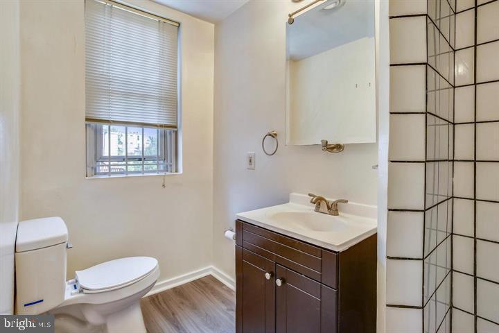 1900 3rd Street Northwest, Unit 2 Washington, DC 20001 - Photo 13 of 14 a bathroom with a sink toilet and vanity