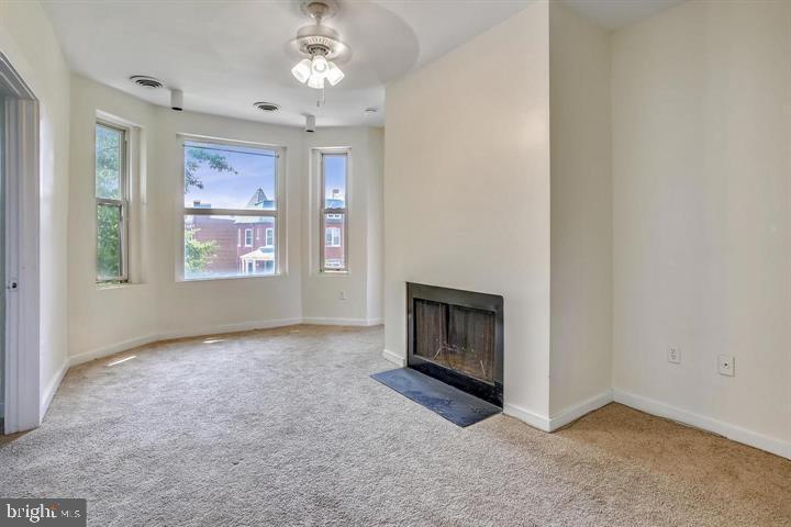 1900 3rd Street Northwest, Unit 2 Washington, DC 20001 - Photo 2 of 14 an empty room with windows and fireplace