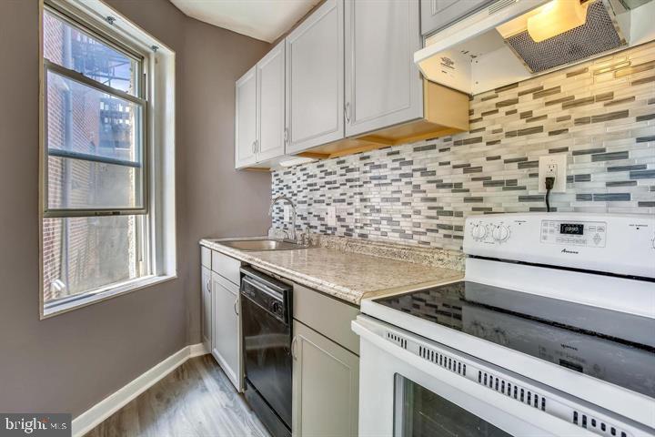1900 3rd Street Northwest, Unit 2 Washington, DC 20001 - Photo 9 of 14 a bathroom with a stove a sink and a window
