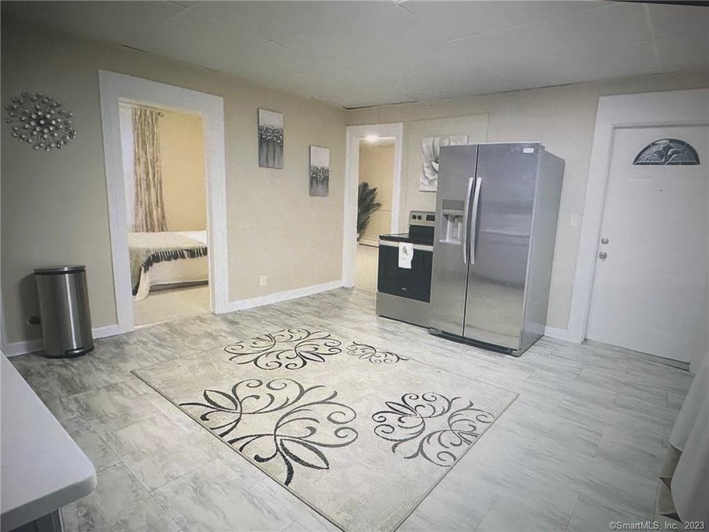 48 Lewis Avenue Meriden, CT 06451 - Photo 1 of 1 a kitchen with stainless steel appliances kitchen island granite countertop a refrigerator and a sink