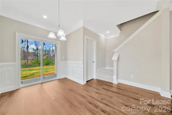 a bathroom with a toilet a sink and a mirror