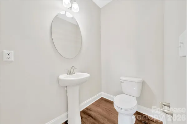 a view of an empty room with a ceiling fan
