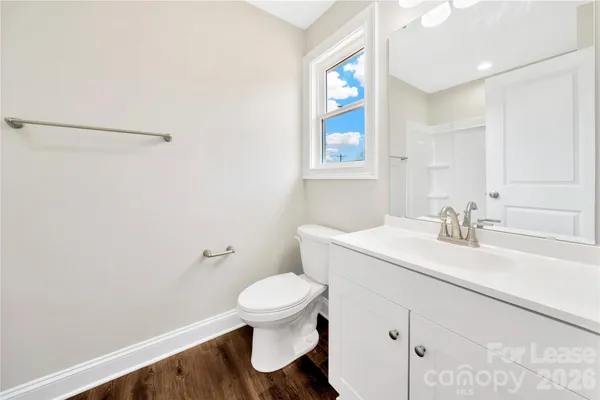 an empty room with closet and a ceiling fan