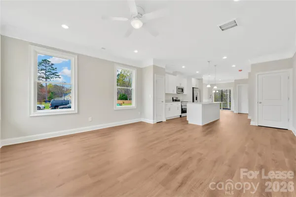 a view of a kitchen with furniture and a window