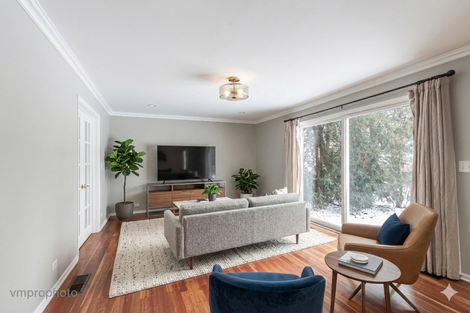 246 Montclair Road Vernon Hills, IL 60061 - Photo 12 of 50 a living room with furniture and a flat screen tv
