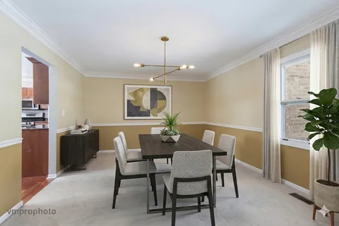 a view of a dining room with furniture and window