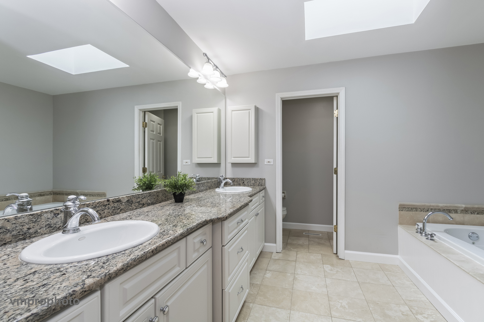 246 Montclair Road Vernon Hills, IL 60061 - Photo 26 of 50 a bathroom with a granite countertop sink and a mirror