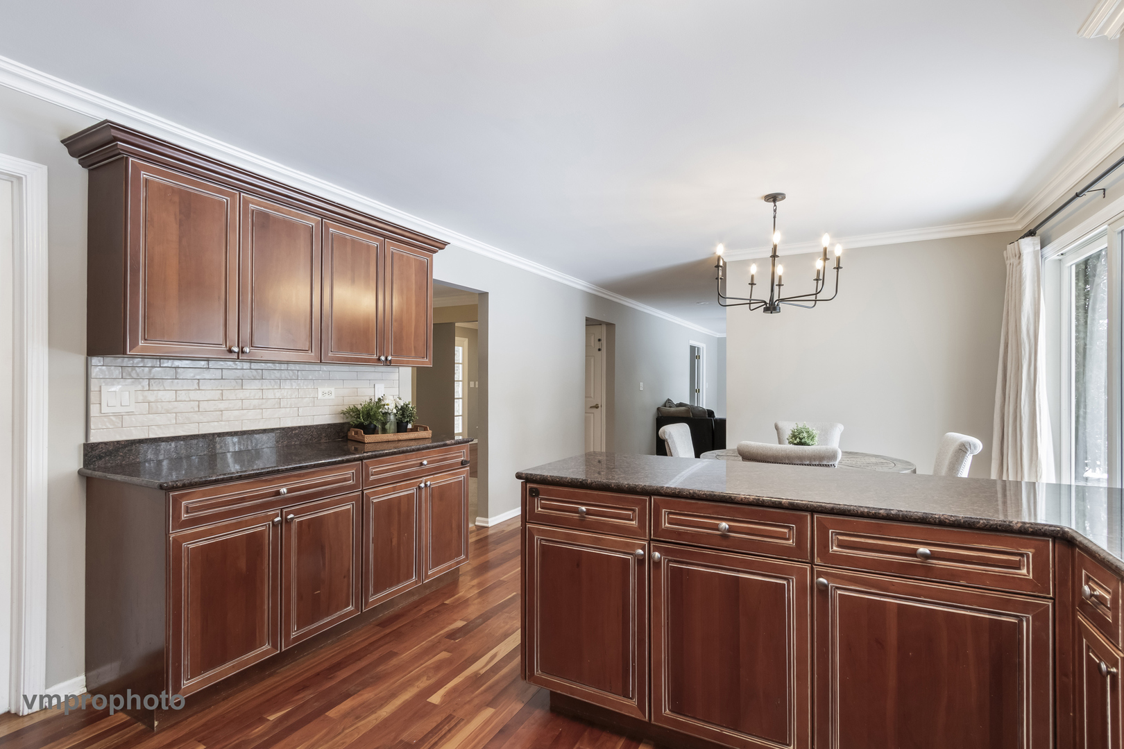 246 Montclair Road Vernon Hills, IL 60061 - Photo 10 of 50 a kitchen with granite countertop stainless steel appliances a sink and cabinets
