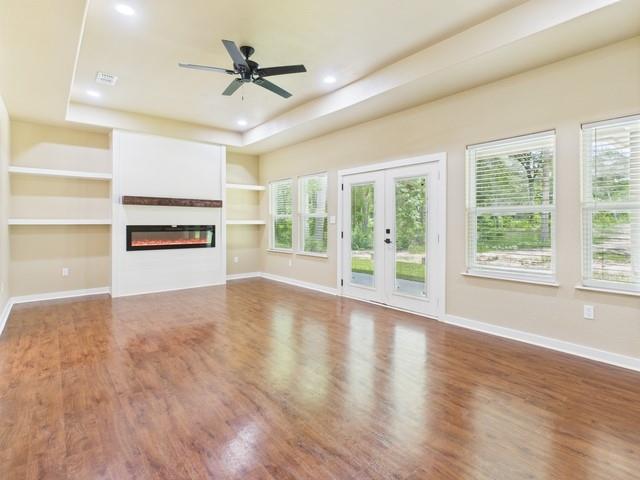 910 Cream Level Road Athens, TX 75751 - Photo 12 of 40 a view of an empty room with a window and wooden floor