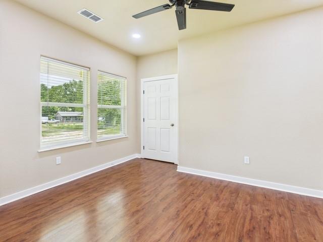 910 Cream Level Road Athens, TX 75751 - Photo 17 of 40 wooden floor in an empty room with a window