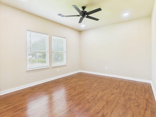 910 Cream Level Road Athens, TX 75751 - Photo 20 of 40 wooden floor in an empty room with a window