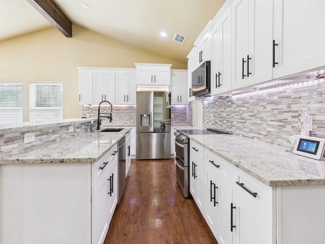 910 Cream Level Road Athens, TX 75751 - Photo 8 of 40 a kitchen with stainless steel appliances granite countertop a sink stove and refrigerator