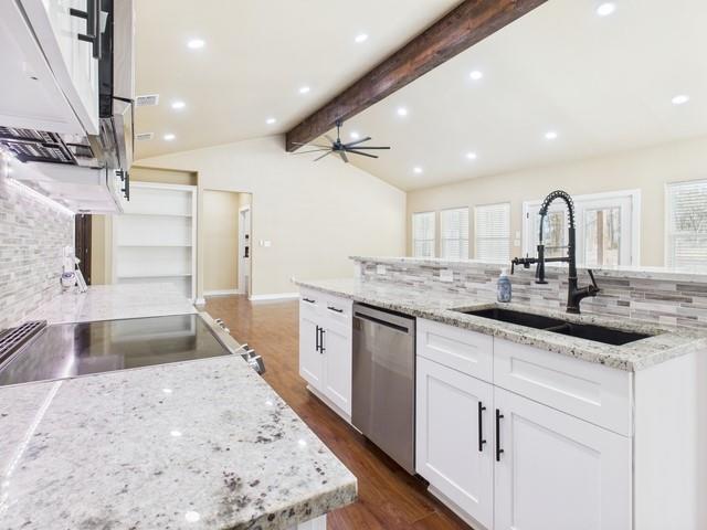 910 Cream Level Road Athens, TX 75751 - Photo 9 of 40 a large kitchen with granite countertop a sink and a stove top oven