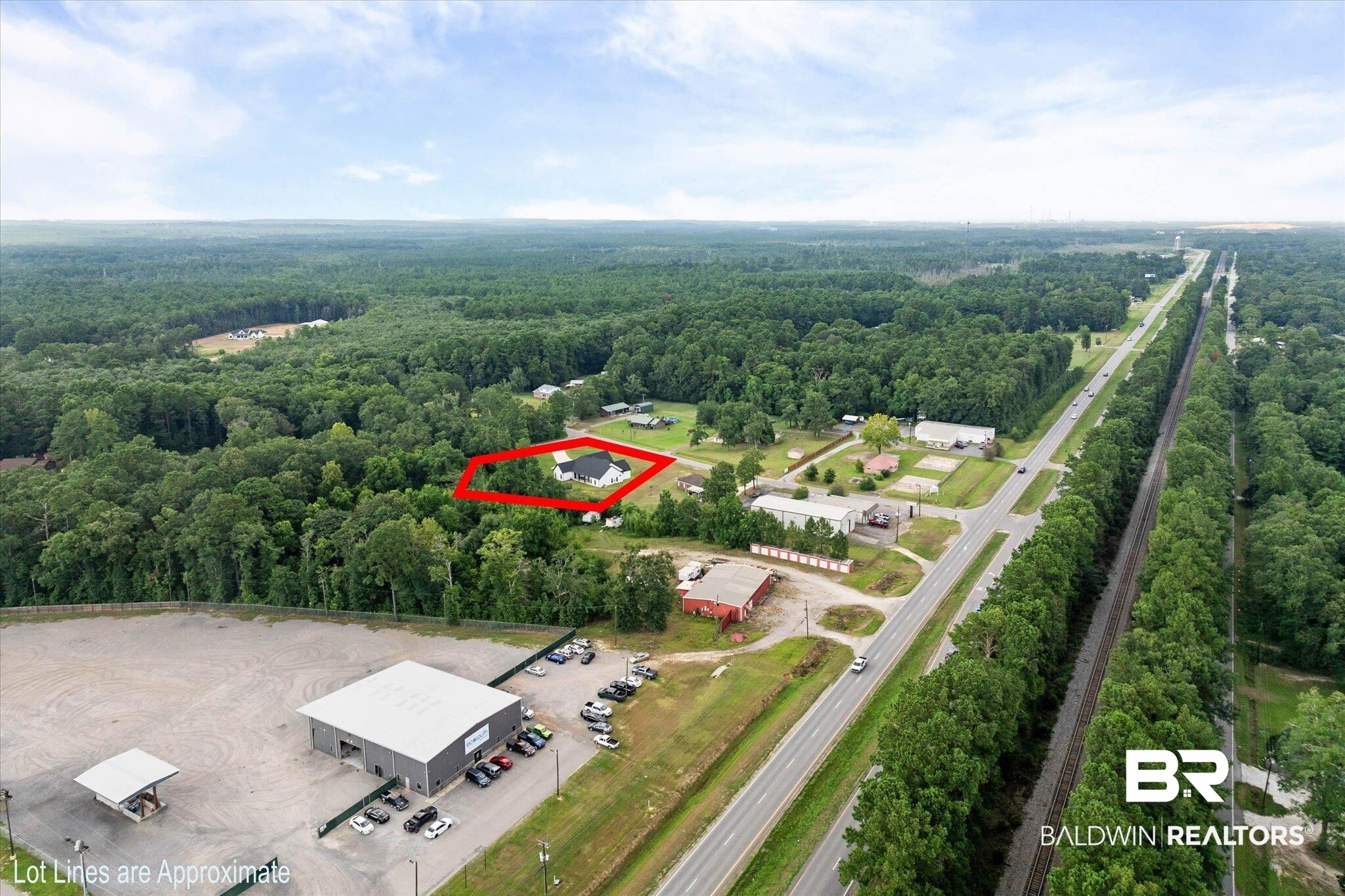 11 Creax Road Axis, AL 36505 - Photo 40 of 46 Aerial perspective showcasing a single-story residence surrounded by extensive tree coverage