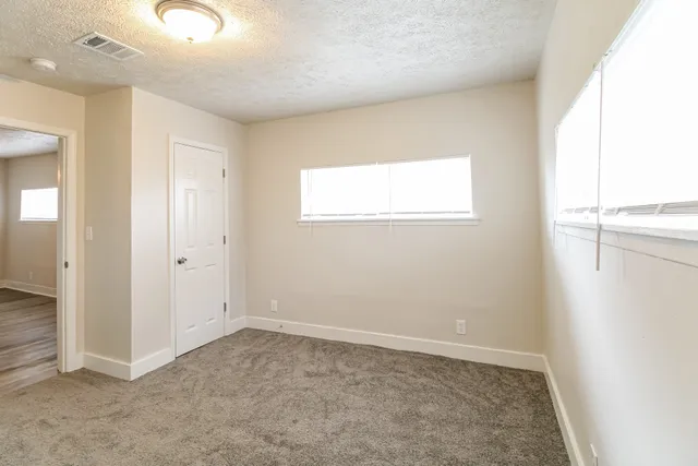 an empty room with windows