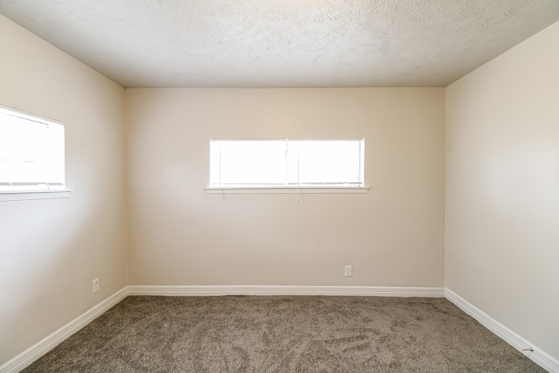 12715 Zavalla Street Houston, TX 77085 - Photo 10 of 16 an empty room with a window