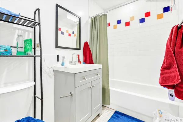 a bathroom with a bathtub and a sink