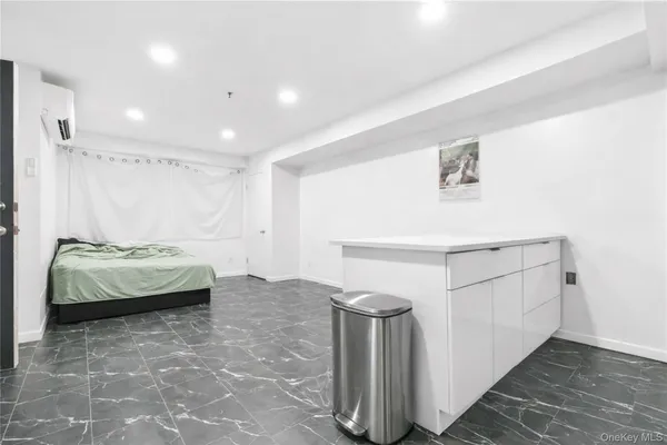 a spacious bedroom with a bed and a table