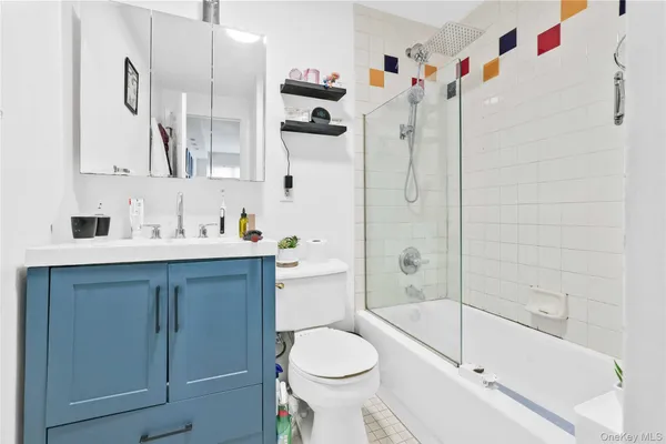 a bedroom with a bed and a desk