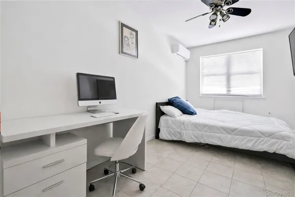 a large white bed in a white room