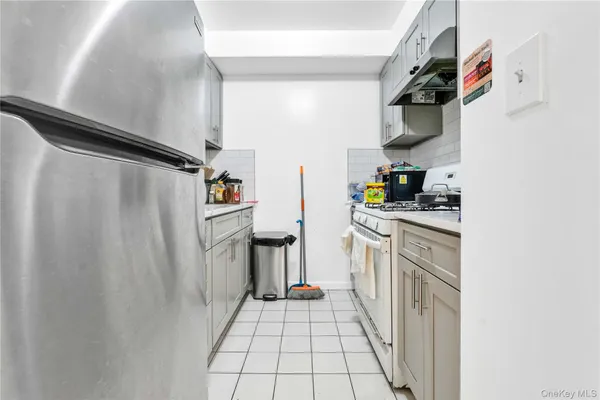 a kitchen with stainless steel appliances a refrigerator and a sink