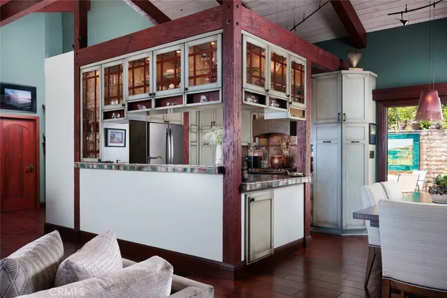 a kitchen with stainless steel appliances granite countertop a refrigerator and a stove