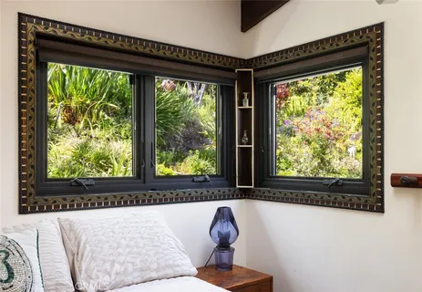 a view of a room that has a bed and a window