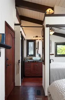 a view of room with furniture and wooden floor