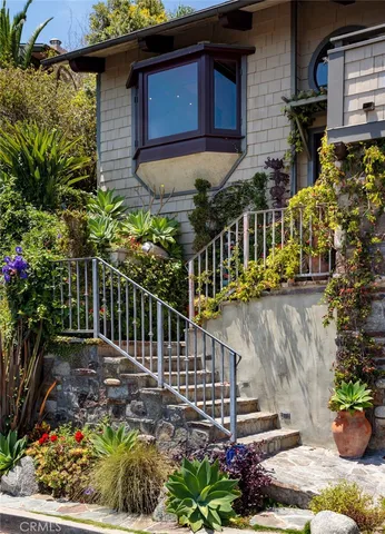 a view of street along with potted plants