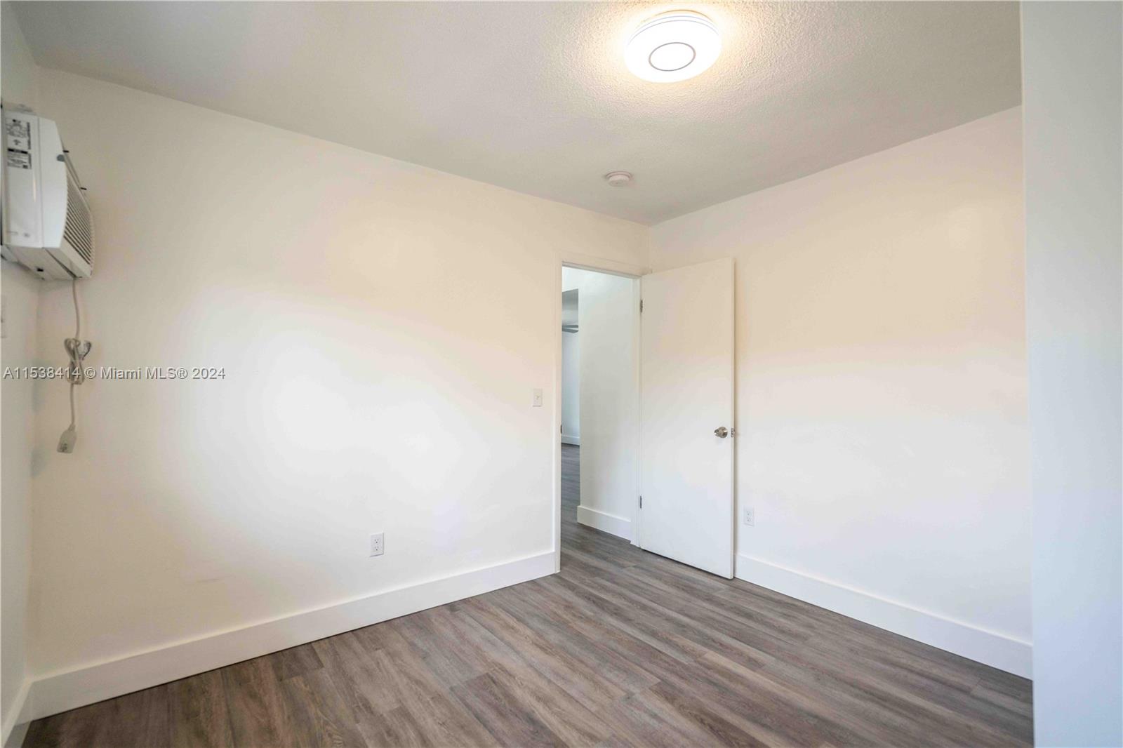 1945 Northwest 29th Street, Unit 8 Miami, FL 33142 - Photo 17 of 31 a view of an empty room