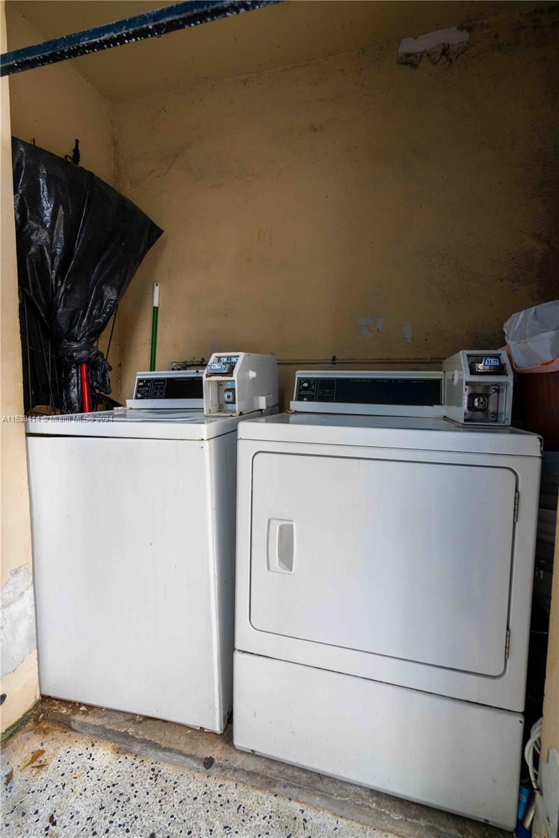 1945 Northwest 29th Street, Unit 8 Miami, FL 33142 - Photo 28 of 31 a utility room with dryer and washer